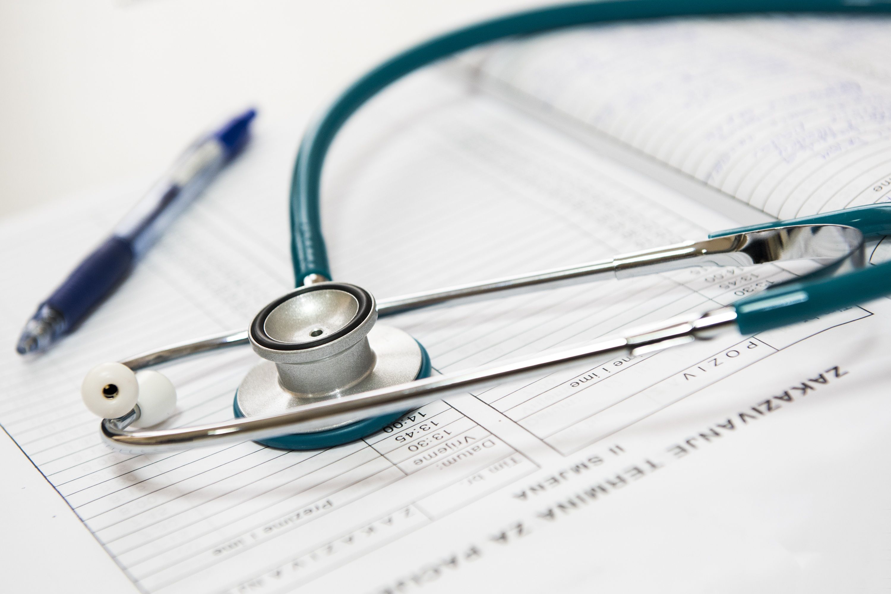 A clinician reviewing notes — evidence-based care.