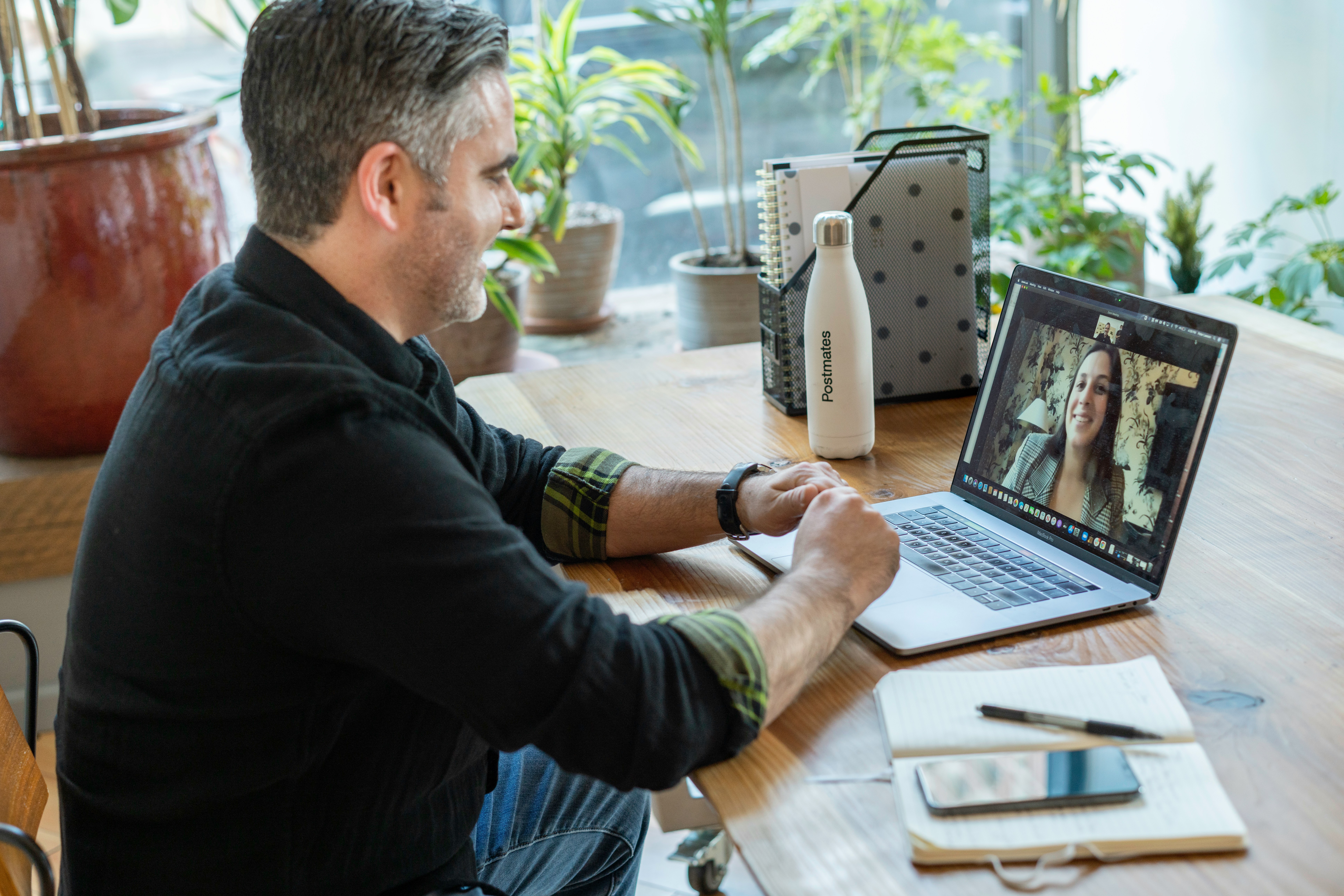 A person on a secure telehealth video visit from a comfortable space at home.